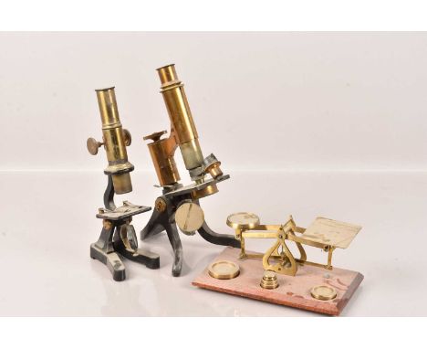 Two Brass Monocular Microscopes, both unnamed, together with a set of scales (parcel)