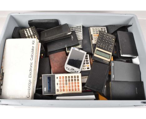 An assortment of Pocket Calculators and Computers, various makers including, Hewlett Packard, Galfa, Sharp, Casio, Sinclair, 