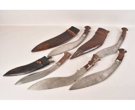 Two large Middle Eastern Kukri Knives, having fullered blades, together with three small examples, only three with sheaths, n