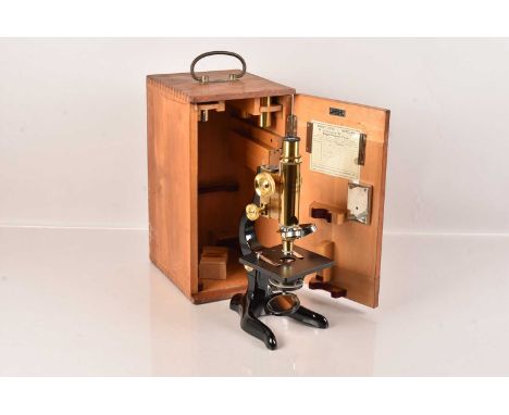 A Vintage Leitz Wetzar Microscope, No.216878, having three objective changer above the square stage, with wishbone stand, com