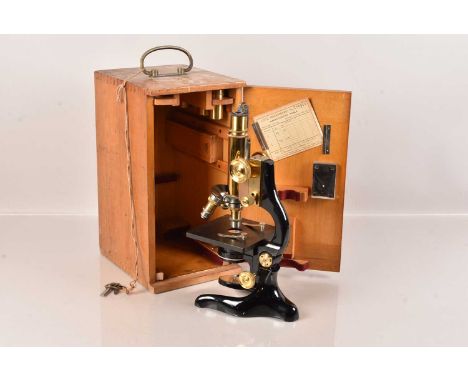 A Vintage Leitz Wetzar Microscope, No.230930, having three objective changer above the square stage, with wishbone stand, com