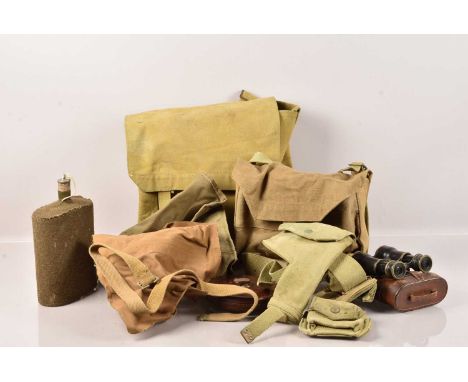 A collection of WWII items, to include a 1945 dated Satchel, a 1942 dated side bag with canteen, a 1943 dated canvas holster,