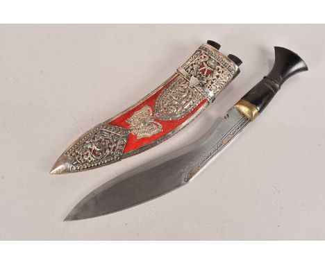 A Middle Eastern White metal Presentation kukri, having horn handle, with 26.5cm long blade, with engraved design, with coppe