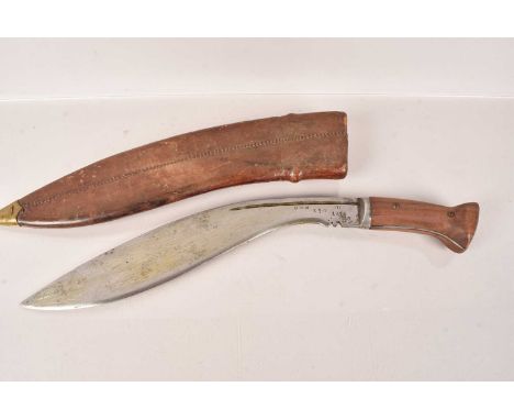 A Military Issue Kukri Knife, having multiple markings to the blade, including 'DHW', 'Broad Arrow and dated 1919, re-issued 