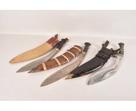 A Horn Handled Middle Eastern Military Kukri, marked 'Military Supply', together with two other Middle Eastern Kukris (3) no 