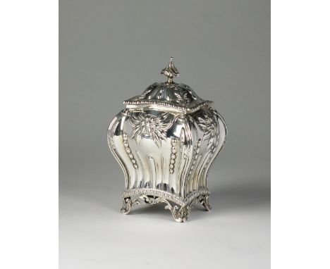 An Edwardian silver tea caddy, Hawksworth, Eyre & Co Ltd, London 1906, of bombe form with embossed decoration, wrythen finial