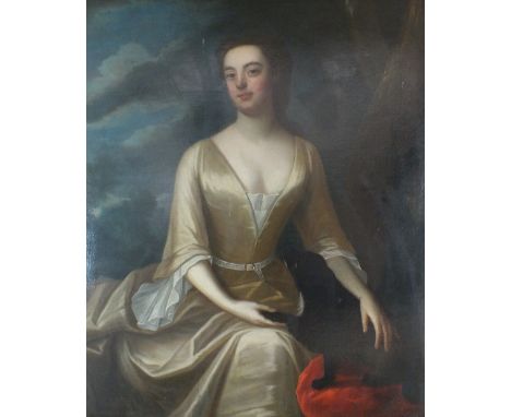 Circle of Godfrey Kneller (1646-1723), Portrait of a lady, three quarter length wearing a gold dress with a black dog seated 