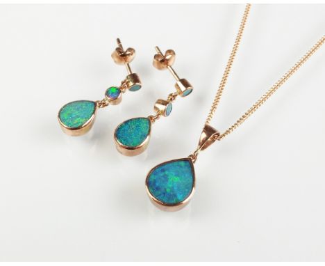 A 9ct rose gold boulder opal pendant, the tear drop shaped opal collet set in rose gold and suspended from rose gold chain, t