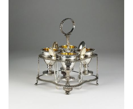A George III silver egg cruet stand, Rebecca Emes & Edward Barnard I, London 1816-1818, the quatrefoil stand with loop handle