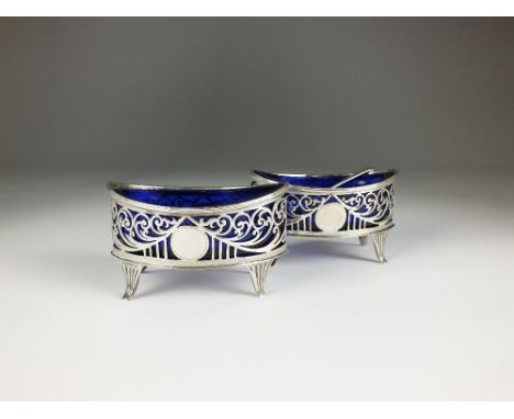 A pair of Edwardian silver salts, Josiah William & Co, London 1908, each of navette form with pierced scroll decoration and r