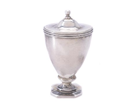 A George III silver urn shaped nutmeg grater by William Parker, London 1806, with a ball finial to the domed and reeded cover