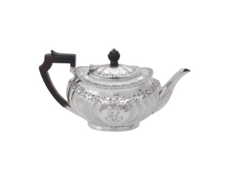 A Victorian silver oval tea pot by Atkin Brothers, Sheffield 1893, with a composition finial and angular handle, the fluted b