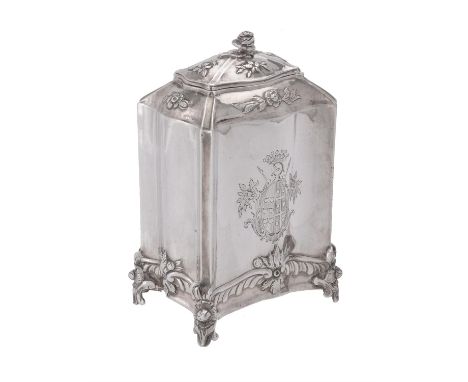 A Continental silver shaped rectangular tea caddy, unmarked, with a floral finial, the body chased with foliate swag decorati