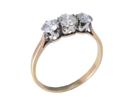 A three stone diamond ring, set with three graduated brilliant cut diamonds in claw settings, approximately 0.65 carats total