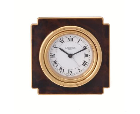 Cartier, Ref. 7512, Brass and brown lacquer desk alarm clock, no. 06622Movement: Manual wind alarmCase: Brass and brown lacqu