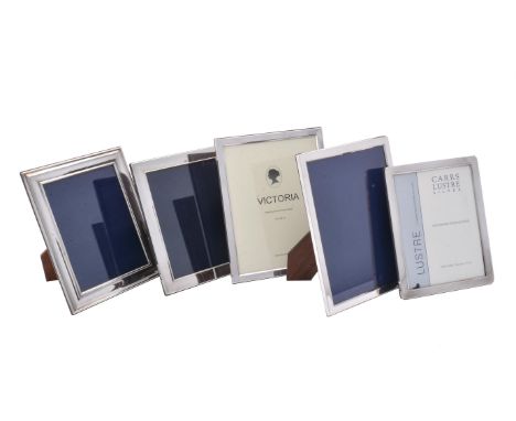 A pair of silver mounted photo frames by Victoria Silverware Ltd., Birmingham 2001, 16.5cm (10 1/2in) high; and three silver 