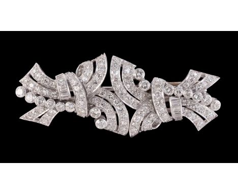 A second quarter of the 20th century diamond double clip brooch, the scrolled crossover panels set with eight, brilliant and 