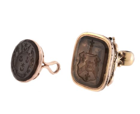 A late 18th century/ early 19th century gold and smokey quartz fob seal, the oval panel carved with a the arms of the BATEMAN