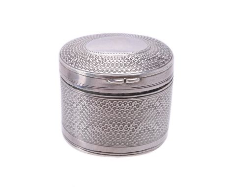 A late Victorian silver oval nutmeg grater by George Unite, Birmingham 1900, with engine turned decoration, the cover with an