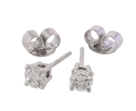 A pair of diamond ear studs, the brilliant cut diamonds in four claw settings, approximately 0.66 carats total, 1.4g grossCon