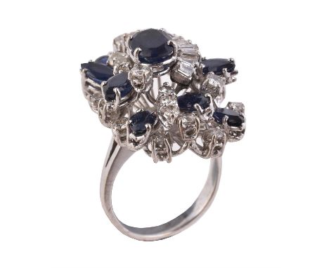 A sapphire and diamond cluster dress ring, the open cluster set with brilliant and baguette cut diamonds, approximately 1.35 
