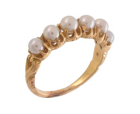 An early 20th century pearl ring, circa 1900, the six pearls in claw settings, to scrolled shoulders, finger size M 1/2, 3.7g