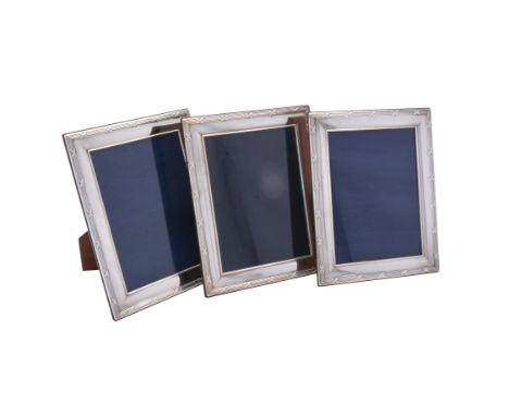 Three silver mounted photo frames by Carr's of Sheffield Ltd., Sheffield 2004 (1) and 2007 (2), with reed and stitch borders,