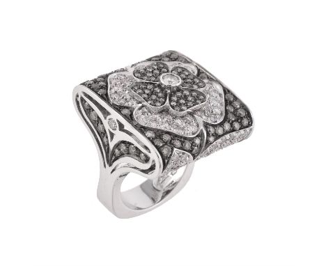 A diamond and brown diamond flower head dress ring by Paulo Piovan, the squared panel set with brilliant cut diamonds, approx