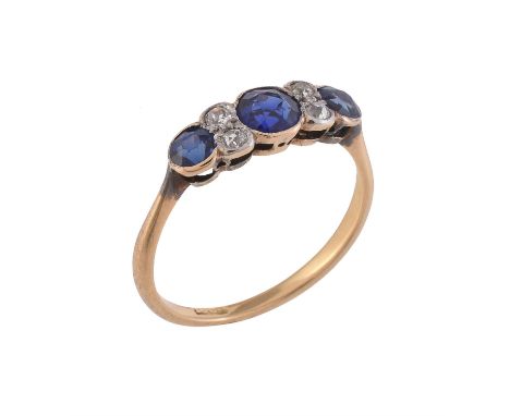 An early 20th century sapphire and diamond seven stone ring, the trio of circular cut sapphires interspaced with two pairs of