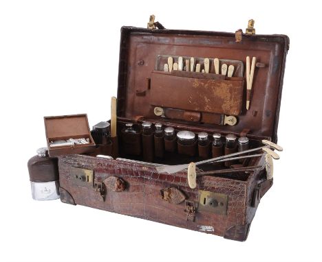 Y Asprey, a brown crocodile travel case, the case stamped A. B. C., with twin loop handles and two flip lock clasps, opening 