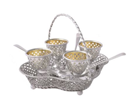 A Victorian silver quatrefoil four cup egg stand by Henry Wilkinson & Co., Sheffield 1859, the trellis pierced cups with gilt