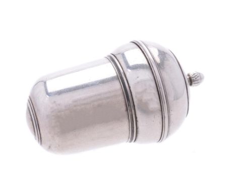 A silver coloured acorn shaped nutmeg grater, unmarked, with an acorn shaped finial to the screw down cover, opening to a ste