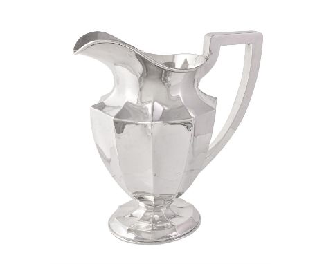 An American silver panelled oval footed water pitcher or jug by The Sweetser Co., early 20th century, 26.5cm (10 1/2in) high,