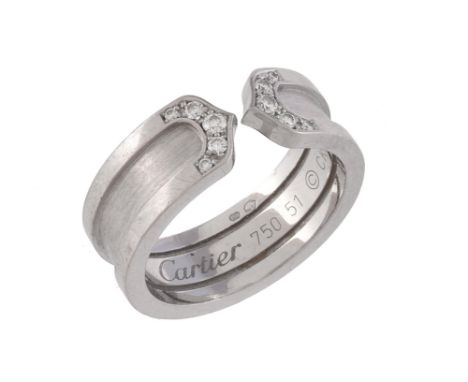A C de Cartier ring by Cartier, the matt and polished band with graduated brilliant cut diamond terminals, approximately 0.08