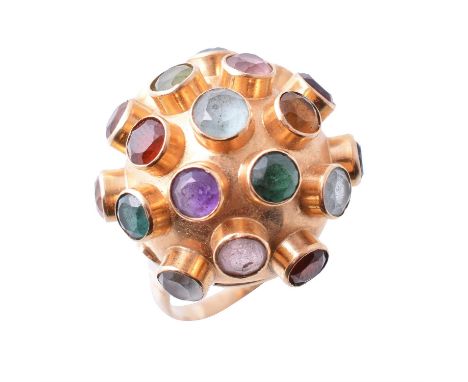A 1970s multi gem set Sputnik style dress ring, set with various circular cut gemstones, including: amethyst, garnet, peridot