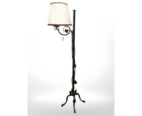 A wrought metal standard lamp 