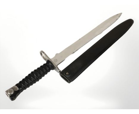 A Swiss Model 1957 bayonet and scabbard, blade 24 cm.
