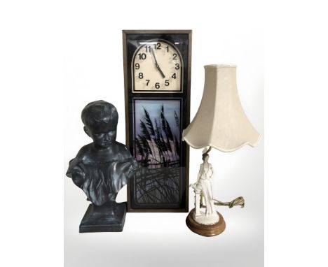 A ceramic bust of a boy, figural table lamp and a clock 