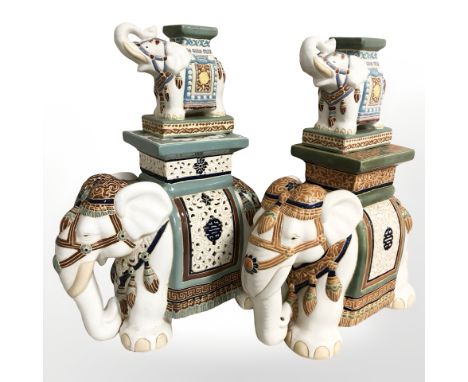 A pair of ceramic elephant plant stands, height 40 cm, and a further miniature pair.