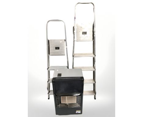 Two aluminium step ladders and a gas heater 