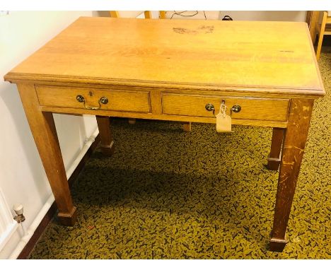 A late Victorian light oak writing desk, circa 1900, slight oversailing top above two frieze drawers with brass swan neck han