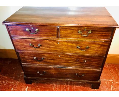 A George III mahogany chest of drawers, circa 1780, slight oversailing moulded edge top, above two short and three long drawe