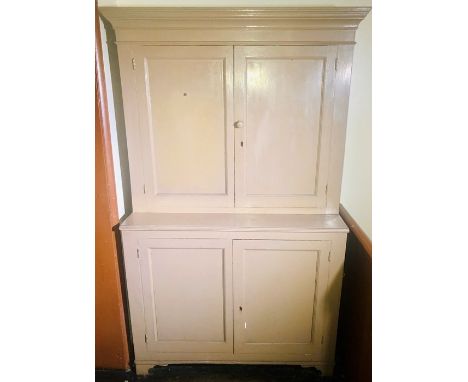 A later painted 19th Century pine country farmhouse kitchen cupboards, moulded cornice above two moulded panel doors, on a tw