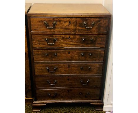 A George III/IV oak secretaire, circa 1820, caddy top moulded edge above a fall front two dummy drawers enclosing fitted inte