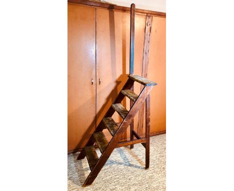 An Edwardian grained pine library steps, carpet fitted on the steps with support handle. 121cm H (210cm with support handle) 