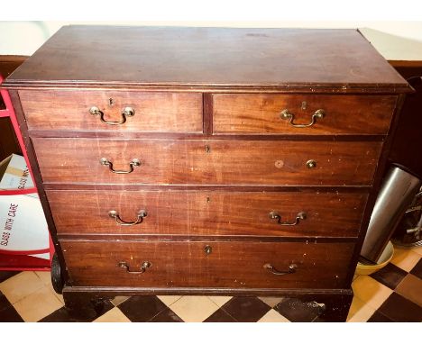 A George III mahogany chest of drawers, circa 1800, slight oversailing moulded edge top above two short over three gradual dr