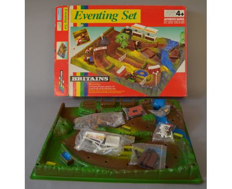 A boxed Britains 'Eventing Set'. A plastic eventing playbase with accessories. The item has been used however appears largely