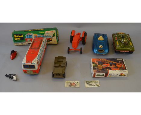 A small group of tinplate and plastic toys including a Marx Tank and a plastic Lipkin Nuffield Tractor model. All have some w