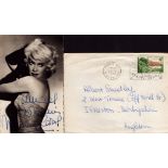 Martine Carol signed 5x3inch black and white photo with original mailing envelope. Good condition