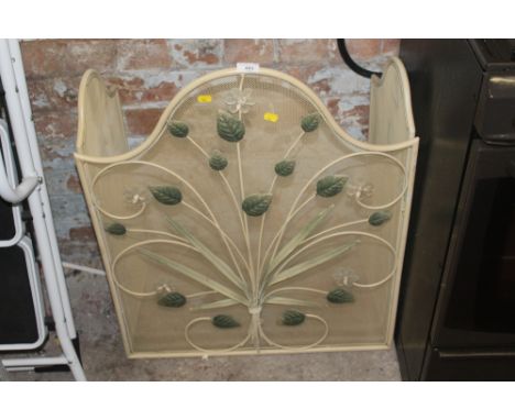A DECORATIVE FIRE SCREEN